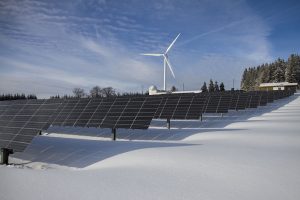 Free Solar Panels on Snow With Windmill Under Clear Day Sky